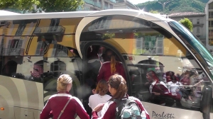 Our sleek bus mirrors the scene at a main plaza in Como. The Red Giants drew a good share of attention.